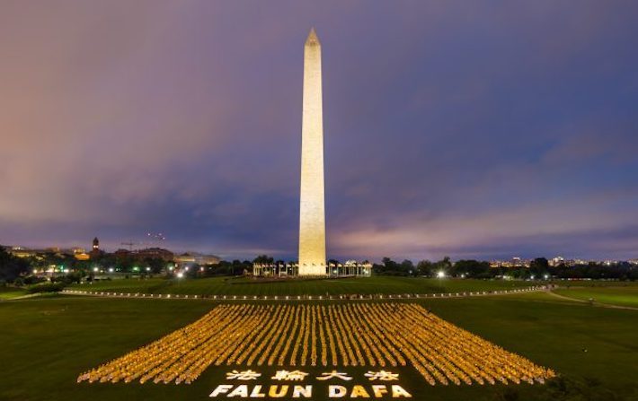 I praticanti del Falun Gong commemorano parenti e amici uccisi per la loro fede in Cina, Washington 22 giugno 2018. (foto: Mark Zou)